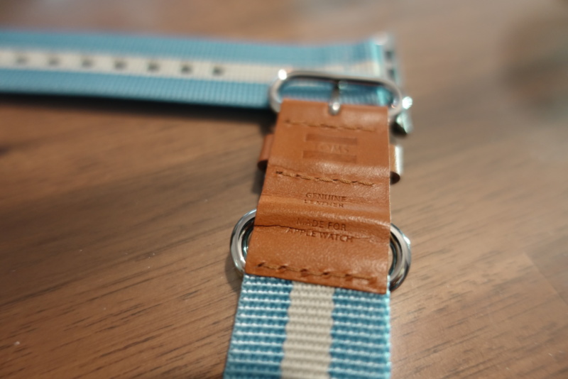 close shot of TOMS for Apple watch band 42mm Light Blue Stripe which reads "GENUINE LEATHER"
